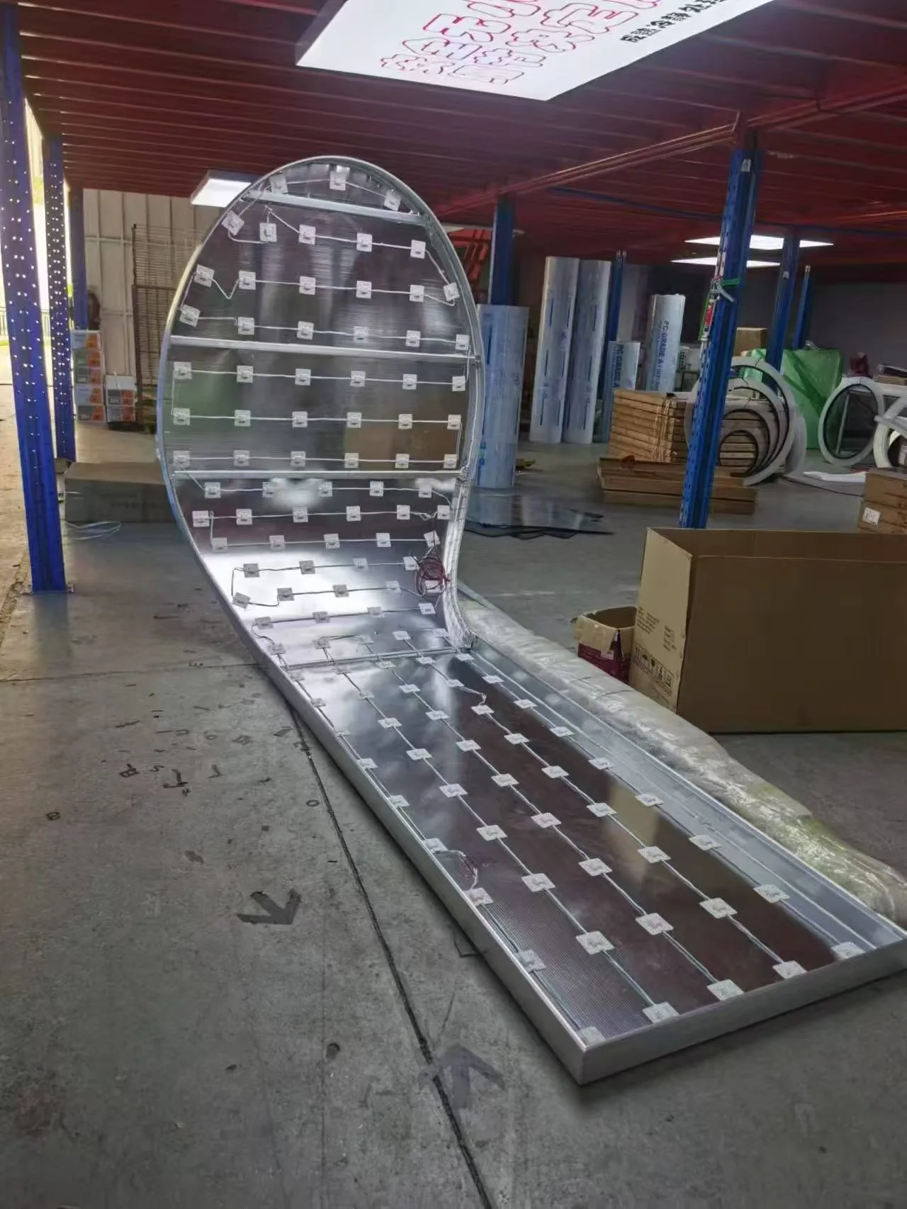 Rear lighting layout of a custom-shaped illuminated structure