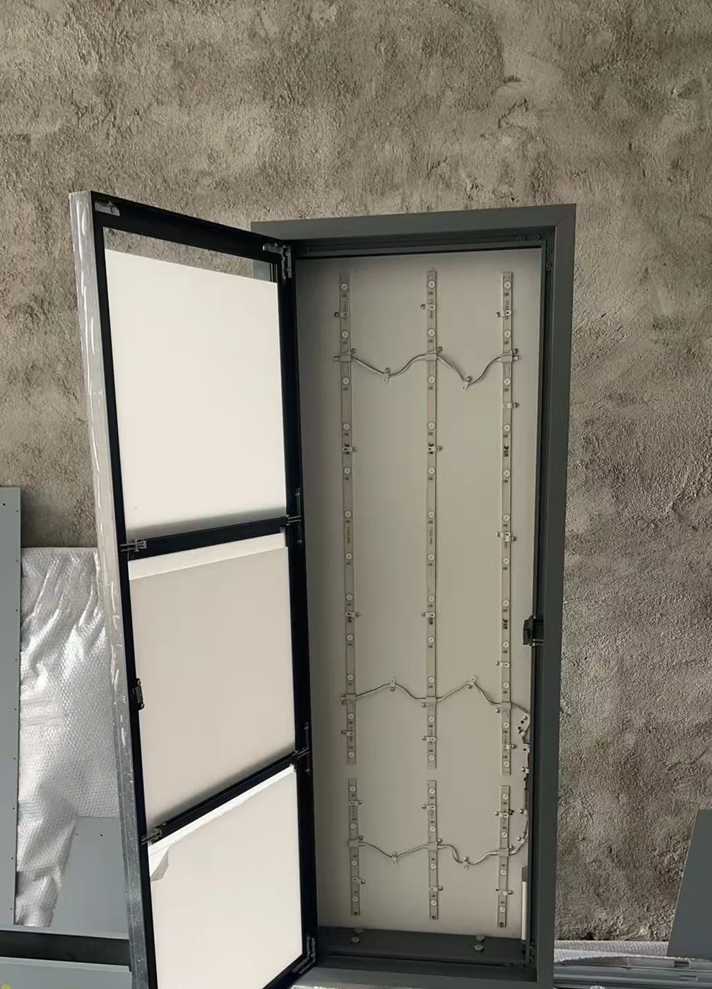 Opened custom display enclosure showing internal LED module layout