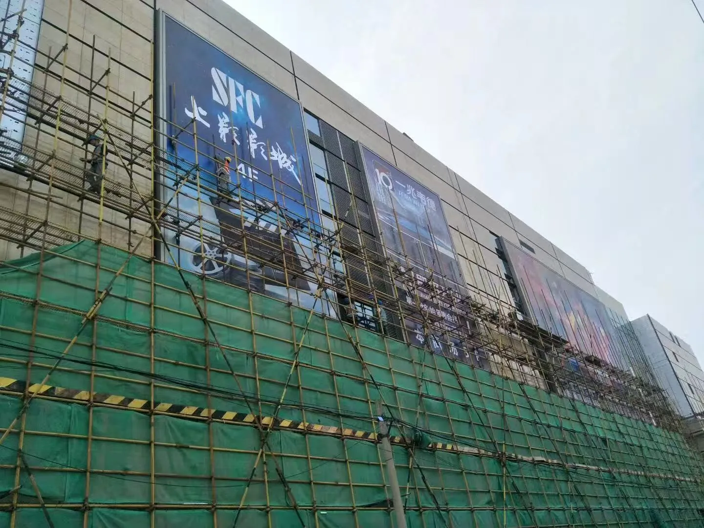 Large-format fabric light box on a commercial facade in Shanghai