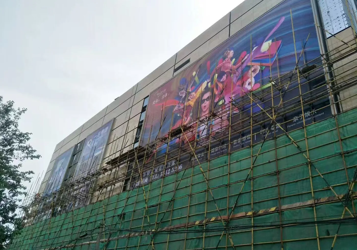 Facade-scale fabric display installation context on a commercial building